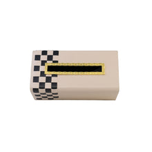 Top of beige Campbell tissue box with black checkered pattern on the side and indented gold opening