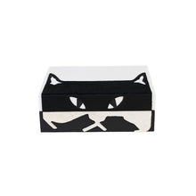 Front of Carson box showing a black and white cat face design and furry texture of design 
