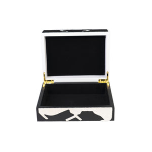 Front of open Carson box showing black and white faux leather, gold hardware and black suede inner lining