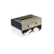 Side of Carson tissue box showing a cat's face design in grey and black faux leather and fur and gold opening