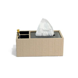 Front of filled Granada tissue box with beige weave patterned leather, dark silver lid and two compartments lined in black suede containing pens