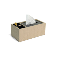 Side of filled Granada tissue box with beige weave patterned leather, dark silver lid and two compartments lined in black suede containing pens