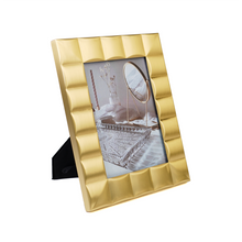 Side view of gold photoframe 