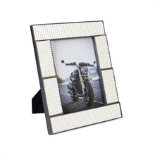 Side view of white & silver photoframe
