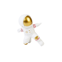 Front view of white & gold figurine