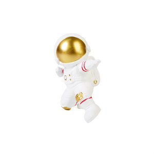 Side view of white & gold figurine