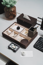 Brown Catania tissue box with brown Oscar organizer, grey Fullerton namecard holder and pink Abbott vase on a light grey office desk