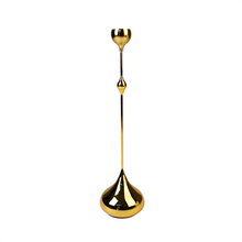 Front view of gold candle holder
