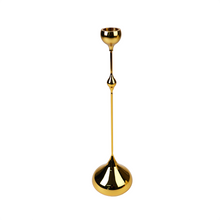 Side view of gold candle holder