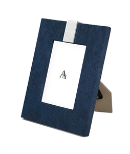 Angled shot of Alden Photoframe showing closeup of blue textured leather finish and silver embellishment