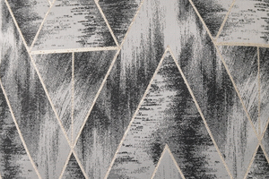 Closeup of geometric pattern on Aspen grey cushion cover in grey, black and gold