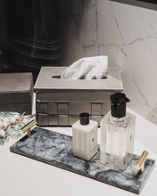 Grey Sloane tissue box with grey Rochefort Tray on a white marble bathroom countertop