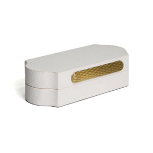 Side of Brixton box showing etched texture on white leather, curved sides with gold patterned hardware