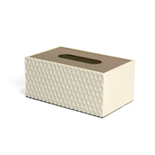 Side of white Castello tissue box with embossed honeycomb pattern and smooth gold lid