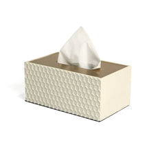 Side of filled white Castello tissue box with embossed honeycomb pattern and smooth gold lid