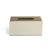 Front of white Castello tissue box with embossed honeycomb pattern and smooth gold lid