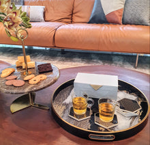 Grey Hamilton box on Avignon large black and gold tray, black and gold Parker coasters and Aquila cake stand on a chestnut brown coffee table