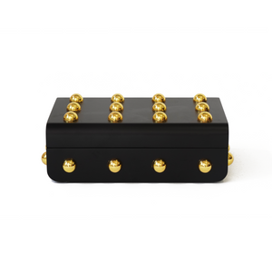 Front view of Velletri box with a smooth black body and decorative gold spherical hardware