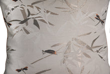 Closeup detailed view of Ansan cushion cover. Dragonfly and bamboo motifs on a pinstriped, light beige base. Pattern is embroidered onto fabric, with a slight sheen.