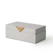 Side of Hamilton grey box with a solid light grey colour, ridged stripe pattern and triangle gold hardware