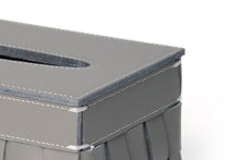 Closeup view of smooth grey faux leather and white stitch details on sides of Sloane tissue box