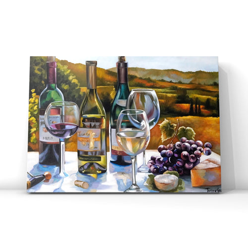 Acrylic realism still life painting of wine bottles, wine glasses, cheese and grapes on a white table in front of a golden and green vineyard. Done on a rectangle canvas