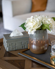 Grey Sloane tissue box with grey and brown Palais vase on a dark brown wooden coffee table